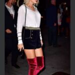 Just In::FANS REVIEW: VERY ANNOYING; Why Will She Dress this way?- Taylor Swift on Thigh-High Red Boots and Short-Shorts